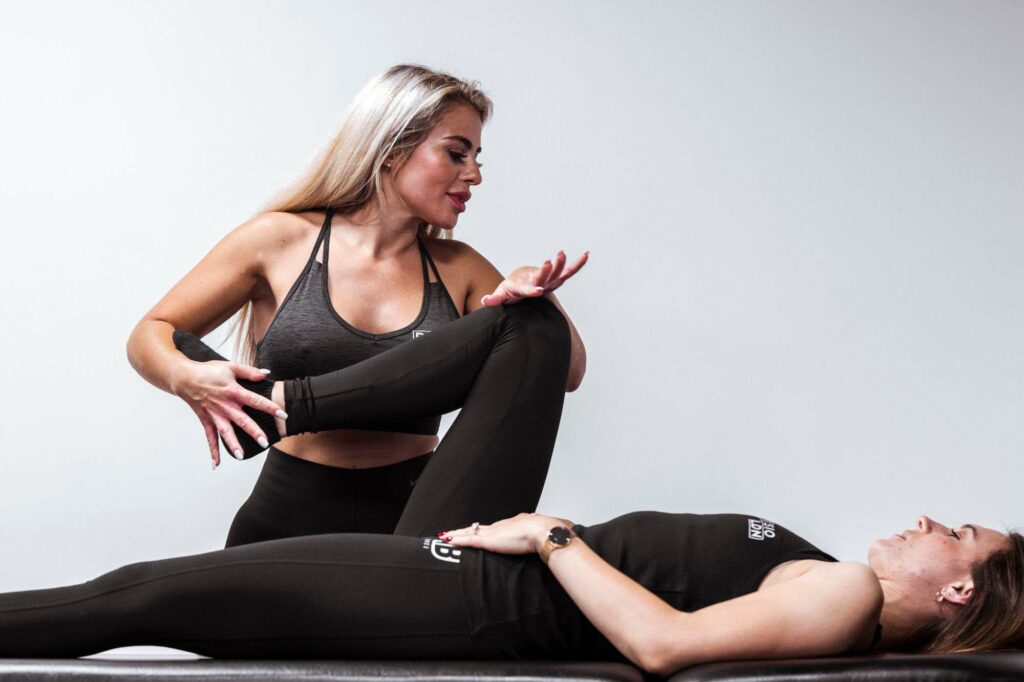 Chiropractic leg adjustment therapy session in progress