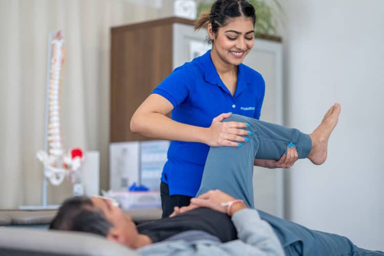 Early range-of-motion test by smiling physiotherapist - One Body LDN Early range-of-motion test by smiling physiotherapist