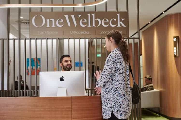 Reception area at OneWelbeck Orthopaedics with patient interaction