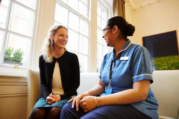 2 Smiling patient consulting with nurse at The London Clinic - One Body LDN Smiling patient consulting with nurse at The London Clinic