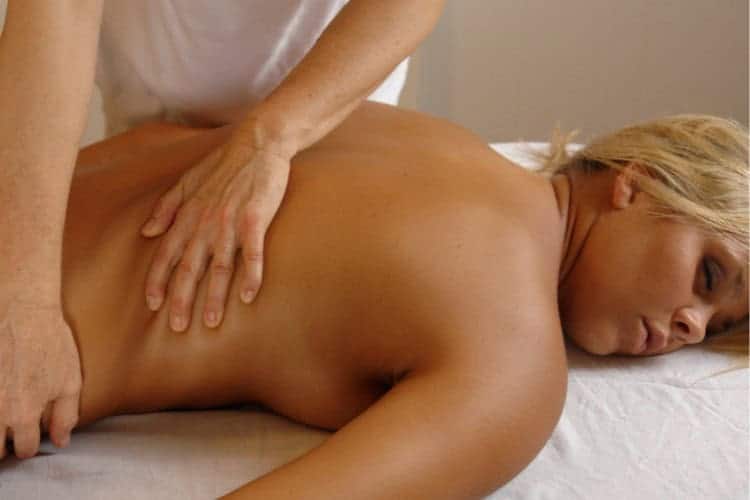 Therapist performing deep tissue back massage in Croydon