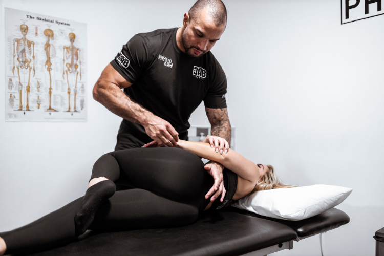 Physiotherapist performing adjustment to restore mobility and strength
