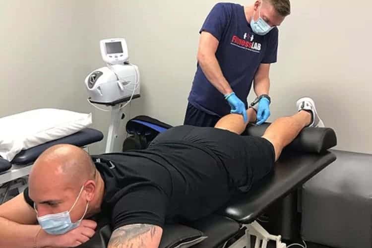 Fitness Lab therapist providing sports injury massage therapy session