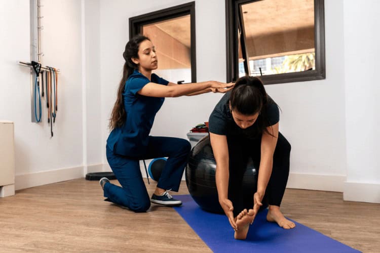 LycaHealth physiotherapist guiding patient through stretch exercise