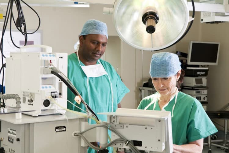 Surgeons at The Chelsea Knee Clinic reviewing surgical equipment