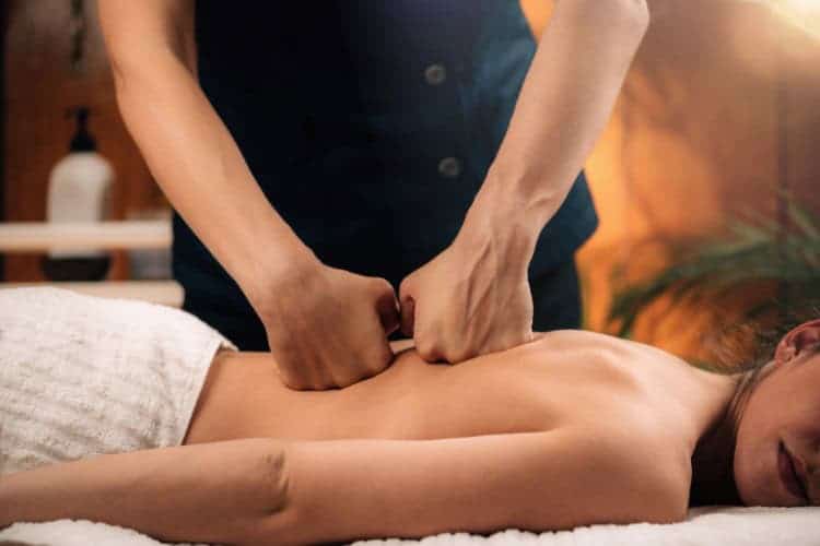 London Osteo therapist delivering rehabilitation deep tissue back massage