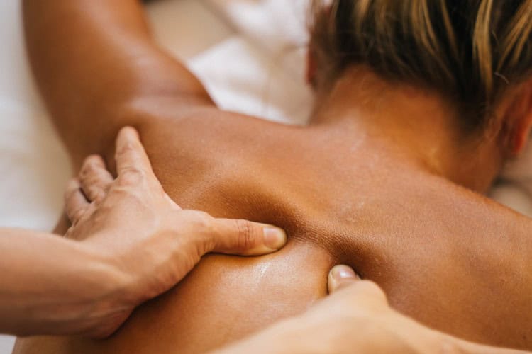 Close-up of deep tissue sports massage on upper back - One Body LDN Close-up of deep tissue sports massage on upper back