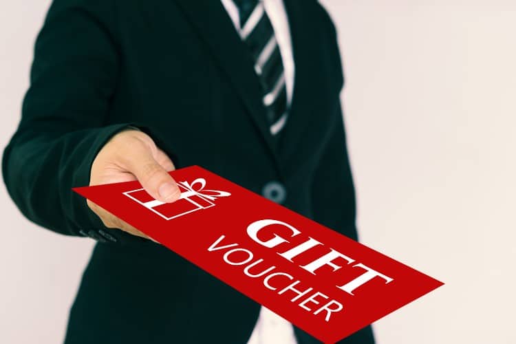 Man presenting physiotherapy gift voucher for thoughtful wellness choice