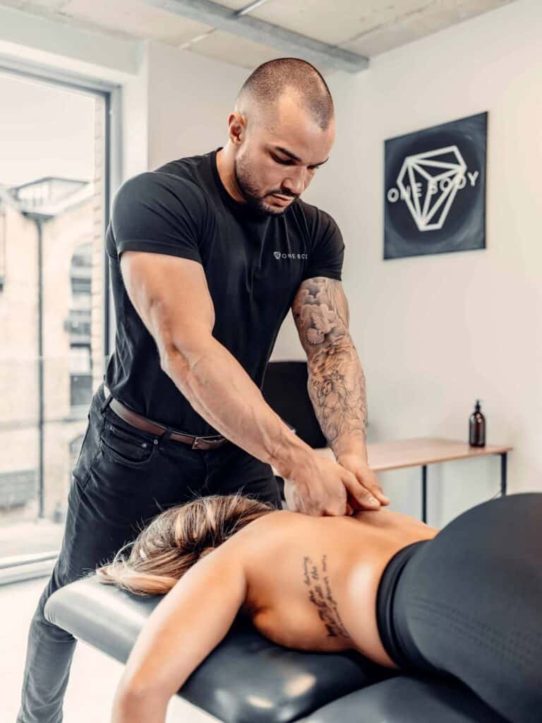 London physio performing deep tissue massage at One Body clinic