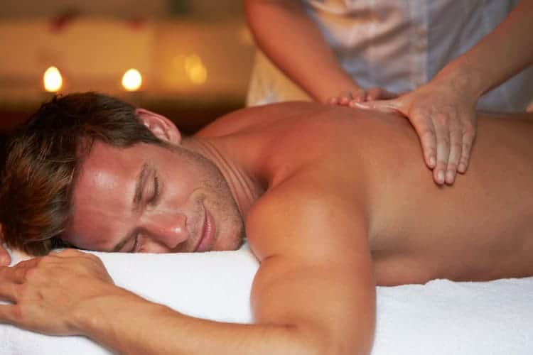 Man enjoying relaxing massage therapy in calming spa environment