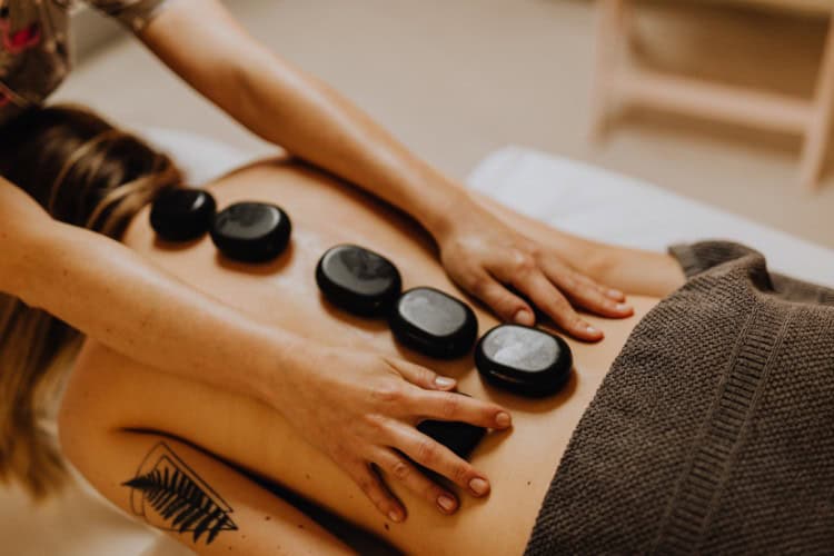 Relaxing hot stone massage as part of home gift voucher