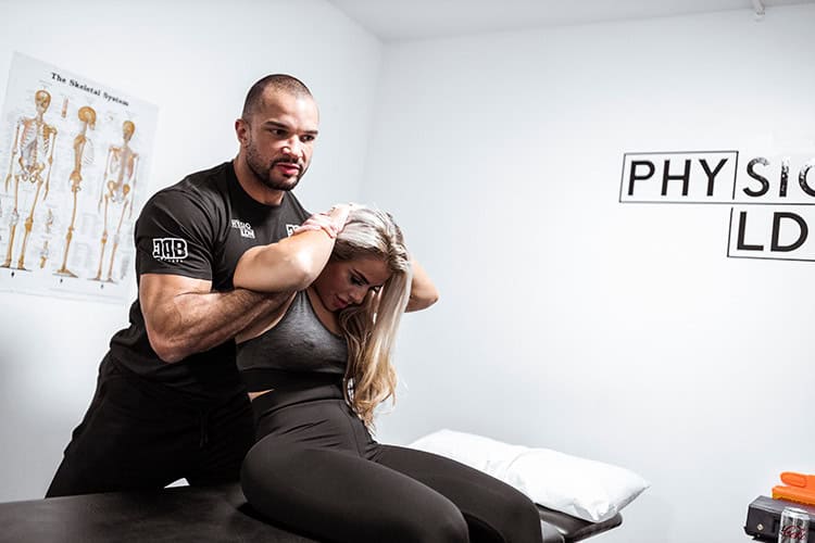 Young woman receiving physiotherapy for neck pain