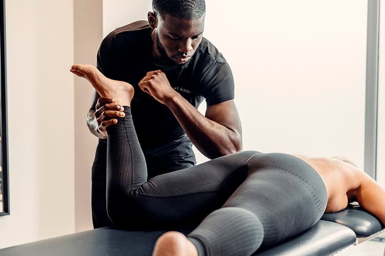 Male professional performing a deep tissue massage