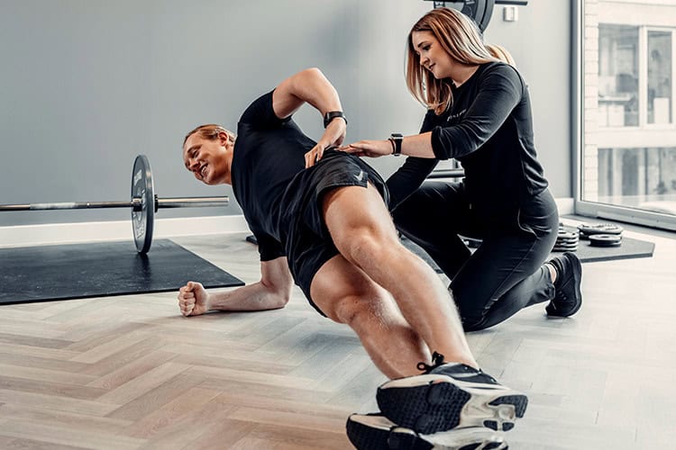 Man with lower back pain during a physiotherapy session
