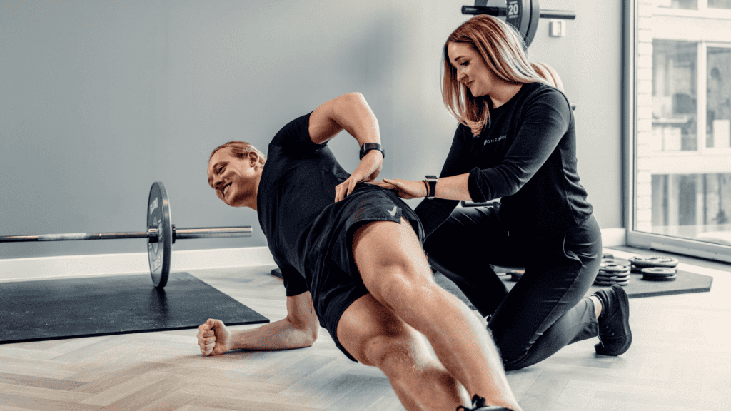 London physiotherapist guiding lower back pain rehab exercise