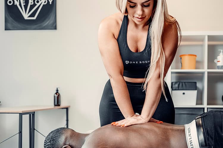 Massage therapist performing chest massage to boost circulation