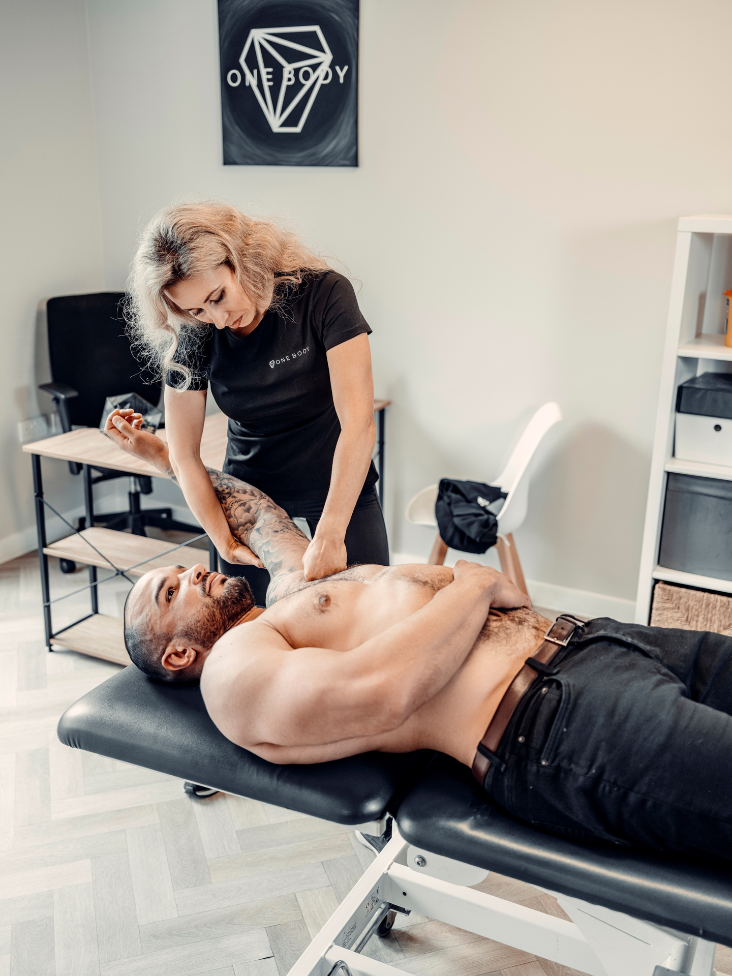 Physiotherapist conducting chest pain massage with a patient at London clinic