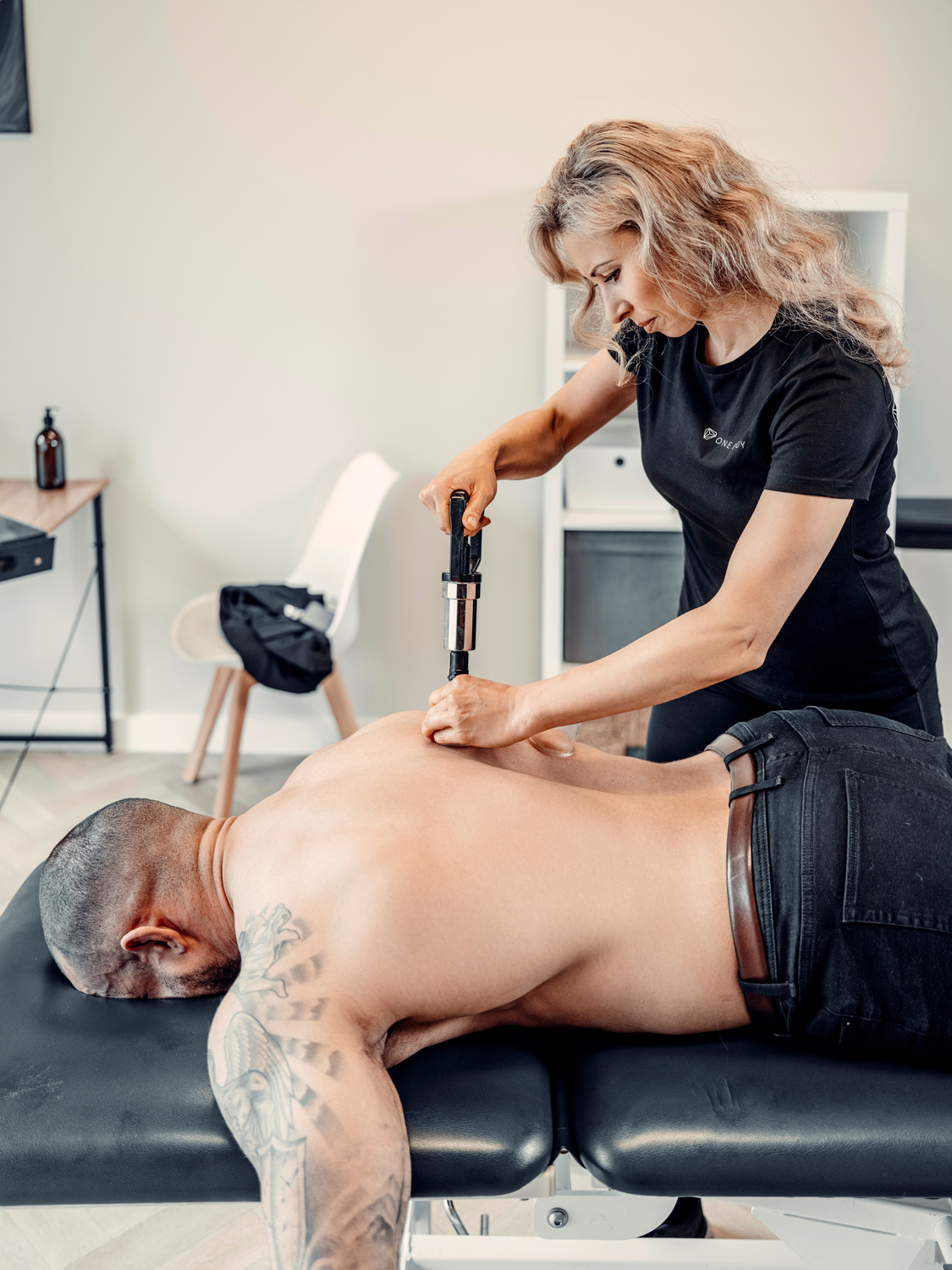 Physiotherapist conducting cupping with a patient at London clinic