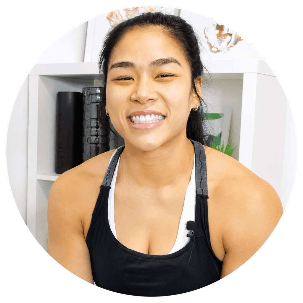 Smiling woman in workout gear at One Body LDN clinic.
